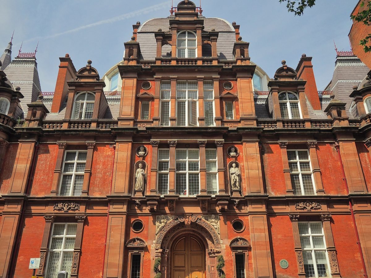 The ornate red-brick front of Caxton Hall on a London street, photographed in daylight