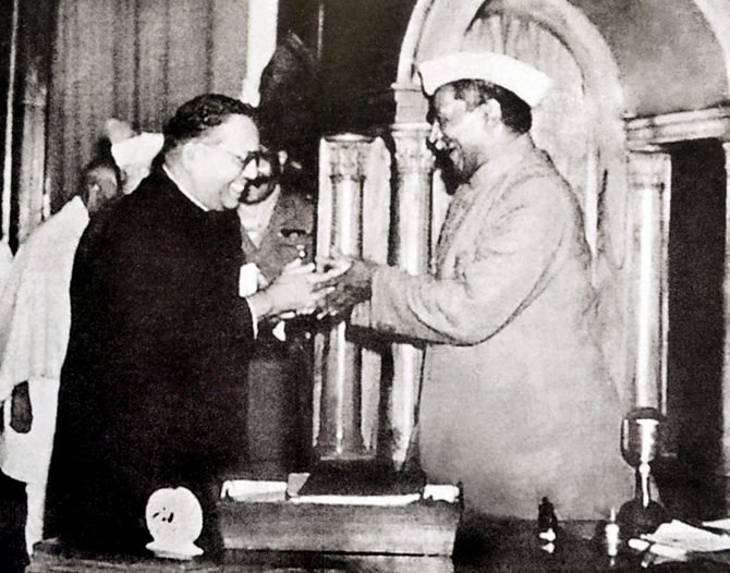 B.R. Ambedkar handing the final draft of the Constitution to Rajendra Prasad in the Constituent Assembly