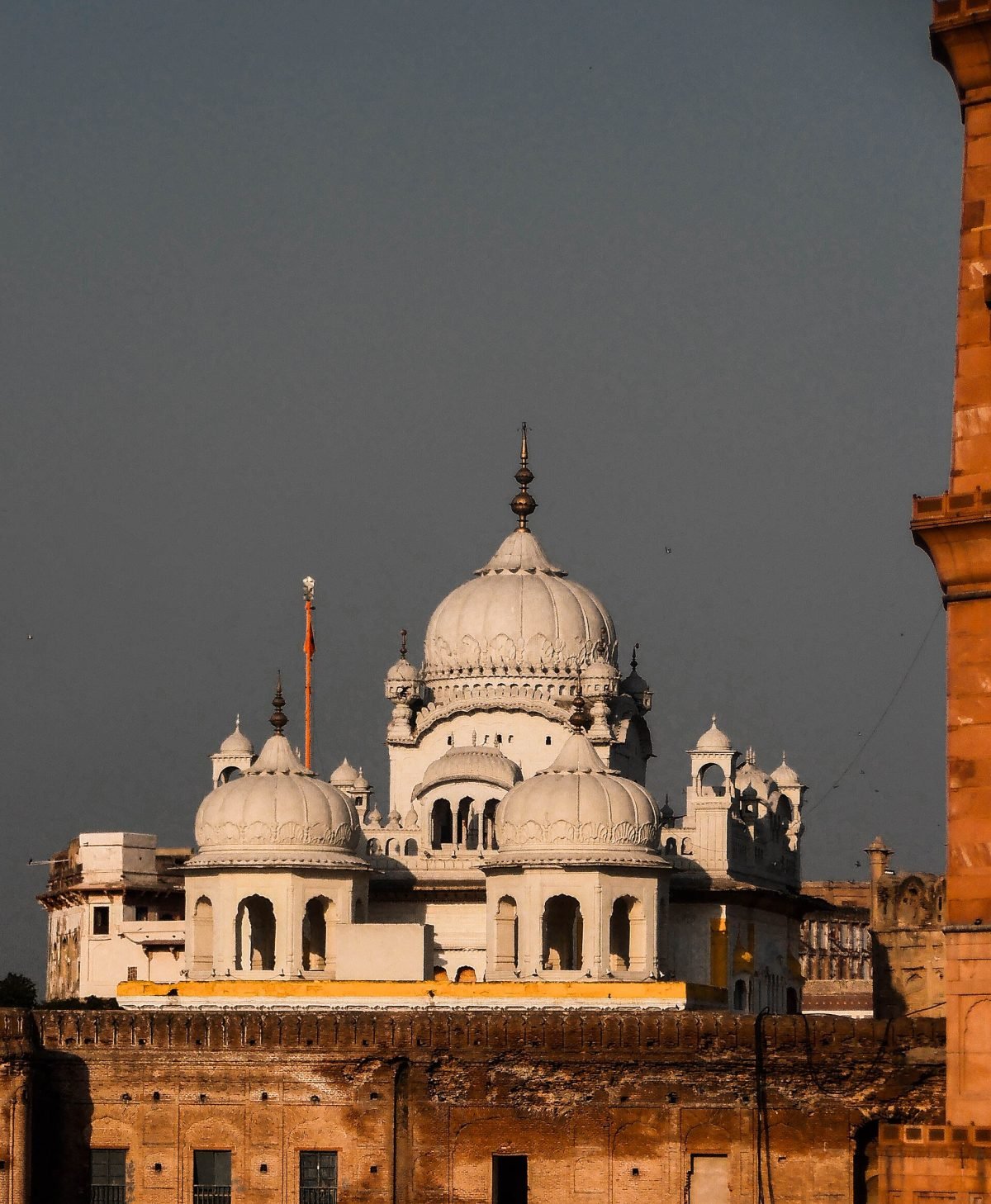 Gurdwara Dera Sahib in Lahore, a white shrine with a golden dome
