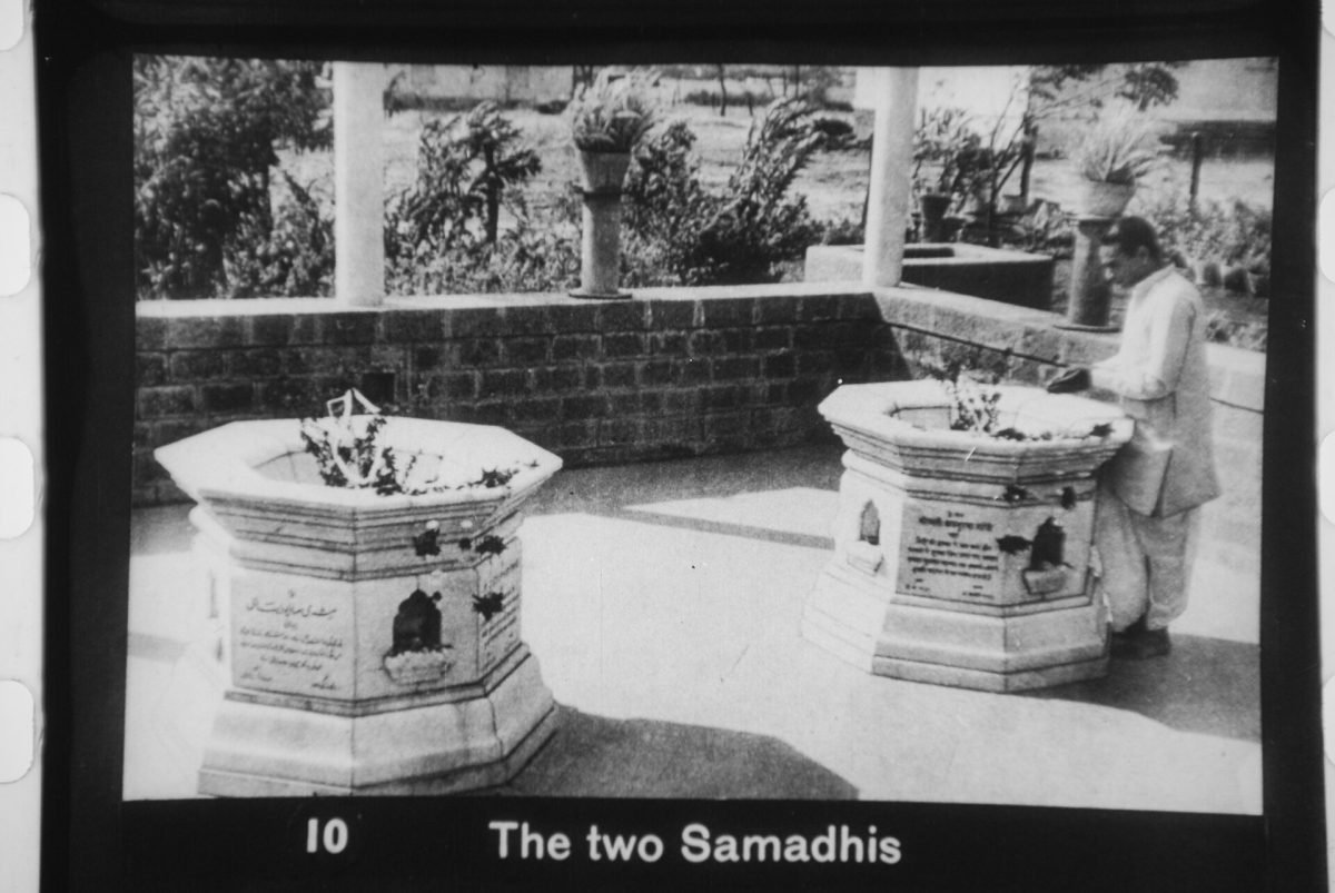 Two small memorial platforms side by side in a garden