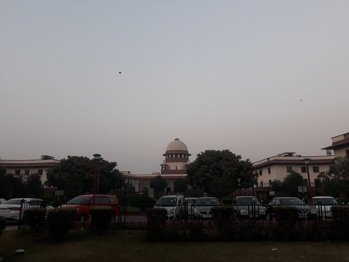 The white domed front of the Supreme Court of India in New Delhi, seen across its lawns